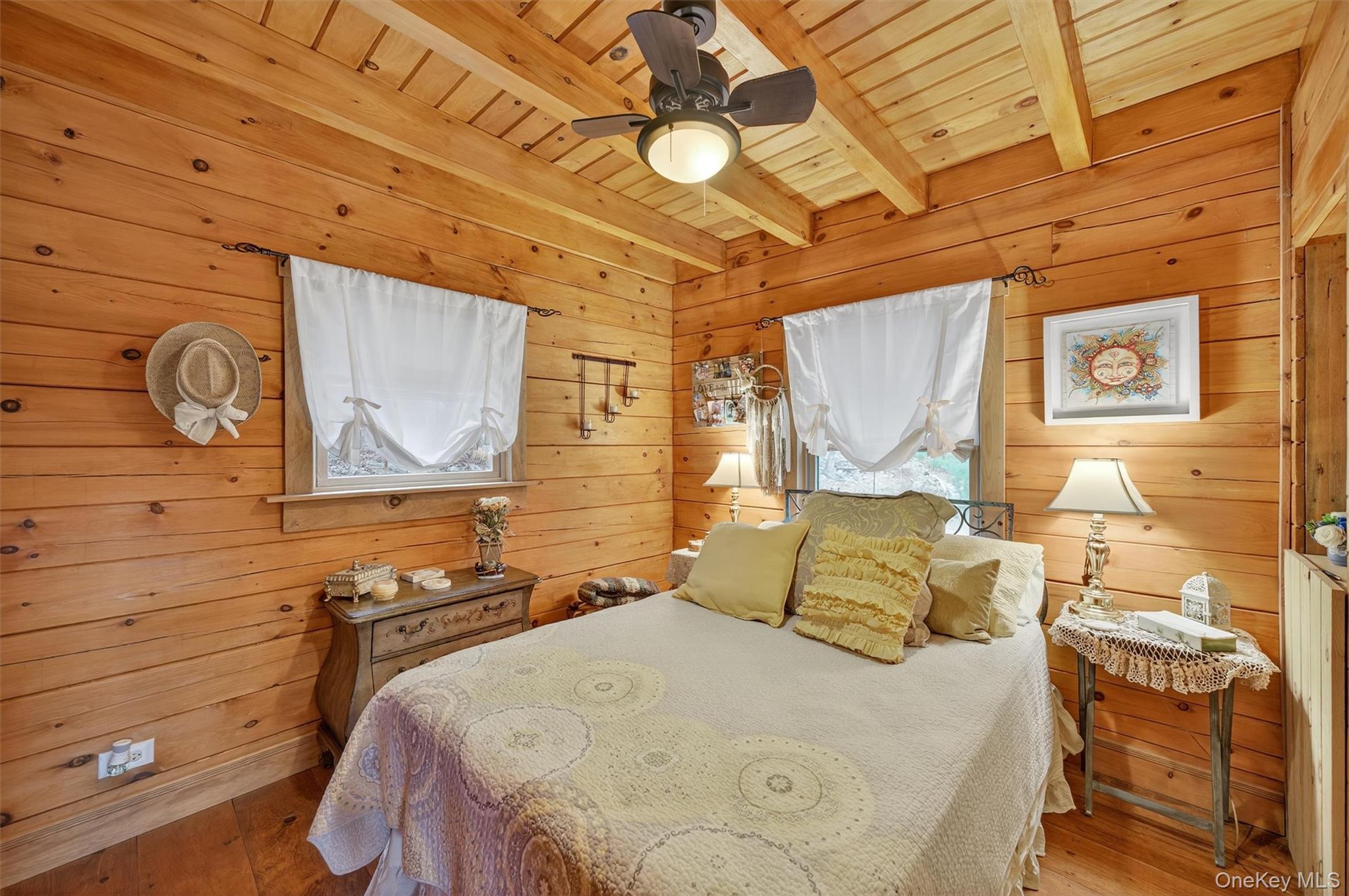 129 Hallock Road Barryville, NY 12719 - Photo 8 of 18 a bedroom with a bed and wooden floor