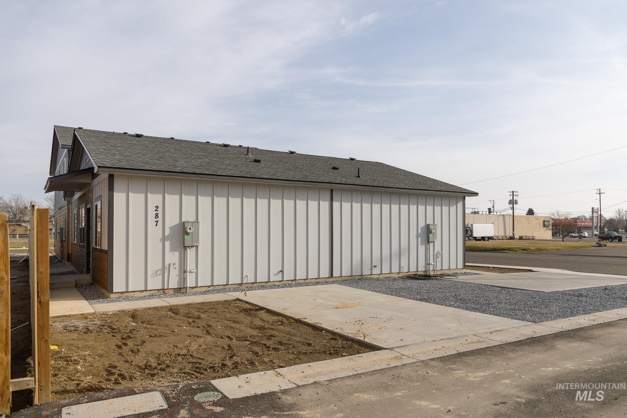 287 Southwest 6th Street, Unit 1 Ontario, OR 97914 - Photo 43 of 49 View of home's exterior featuring board and batten siding and a shingled roof