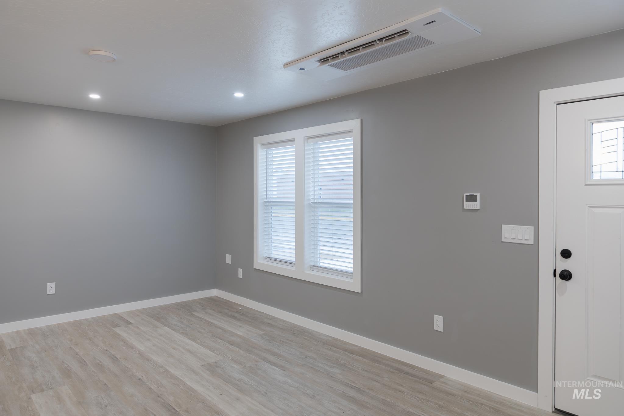 287 Southwest 6th Street, Unit 1 Ontario, OR 97914 - Photo 9 of 49 Entrance foyer featuring cooling unit, light wood finished floors, and recessed lighting