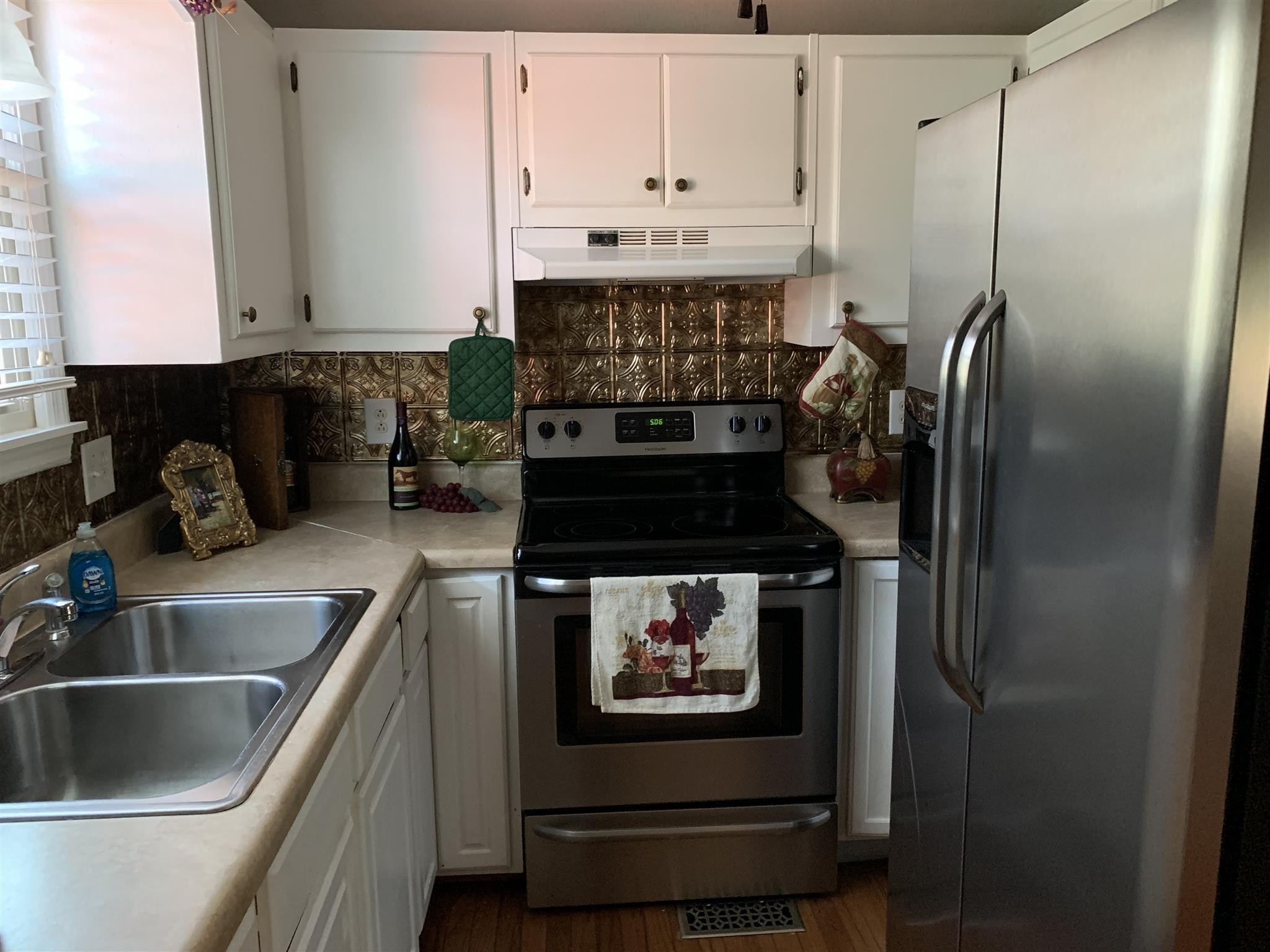 6069 Highway 76 East Springfield, TN 37172 - Photo 10 of 11 a kitchen with stainless steel appliances granite countertop a stove and a refrigerator