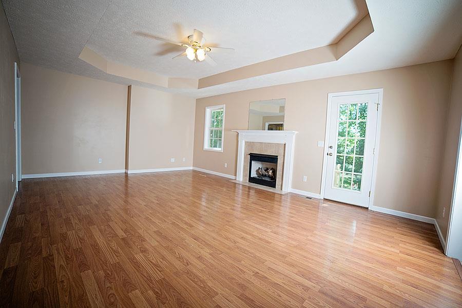 134 Hunt Creek Road Manchester, TN 37355 - Photo 2 of 14 The oversize Living Room features hardwood floors, trey ceiling, and a cozy natural gas fireplace.