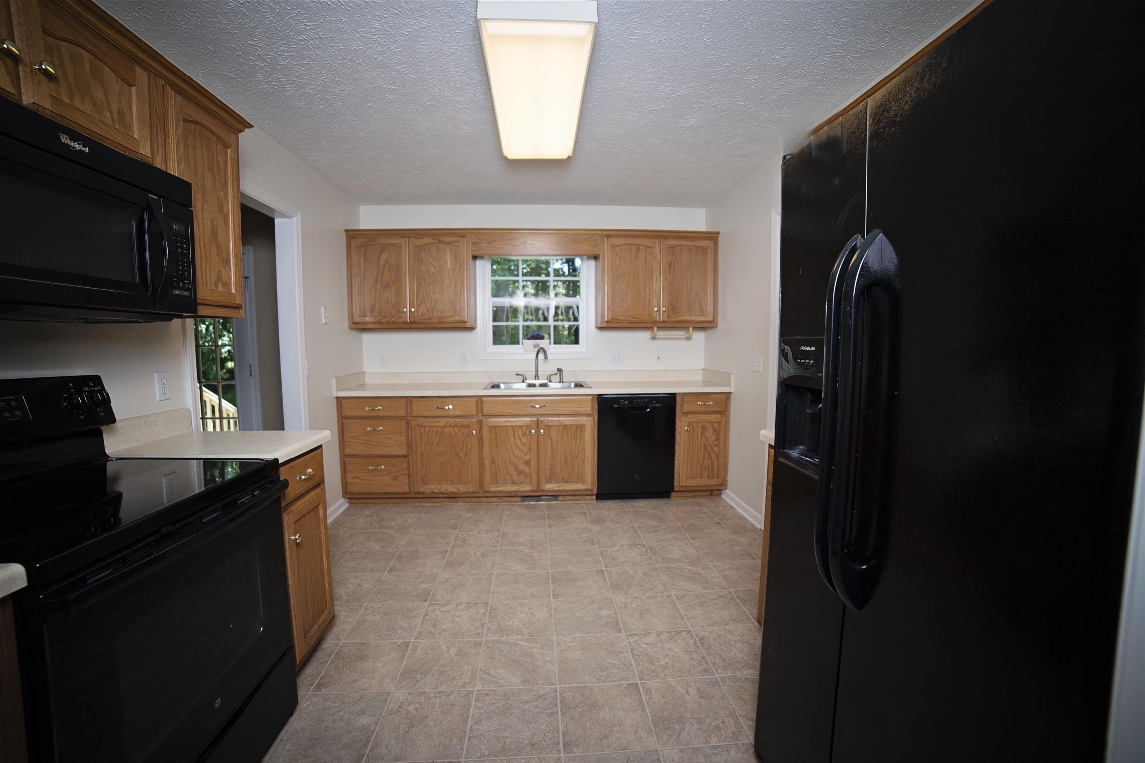 134 Hunt Creek Road Manchester, TN 37355 - Photo 4 of 14 Along with new flooring, the Kitchen features New Dishwasher, New Range, and a Microwave Oven. Refrigerator is negotiable.