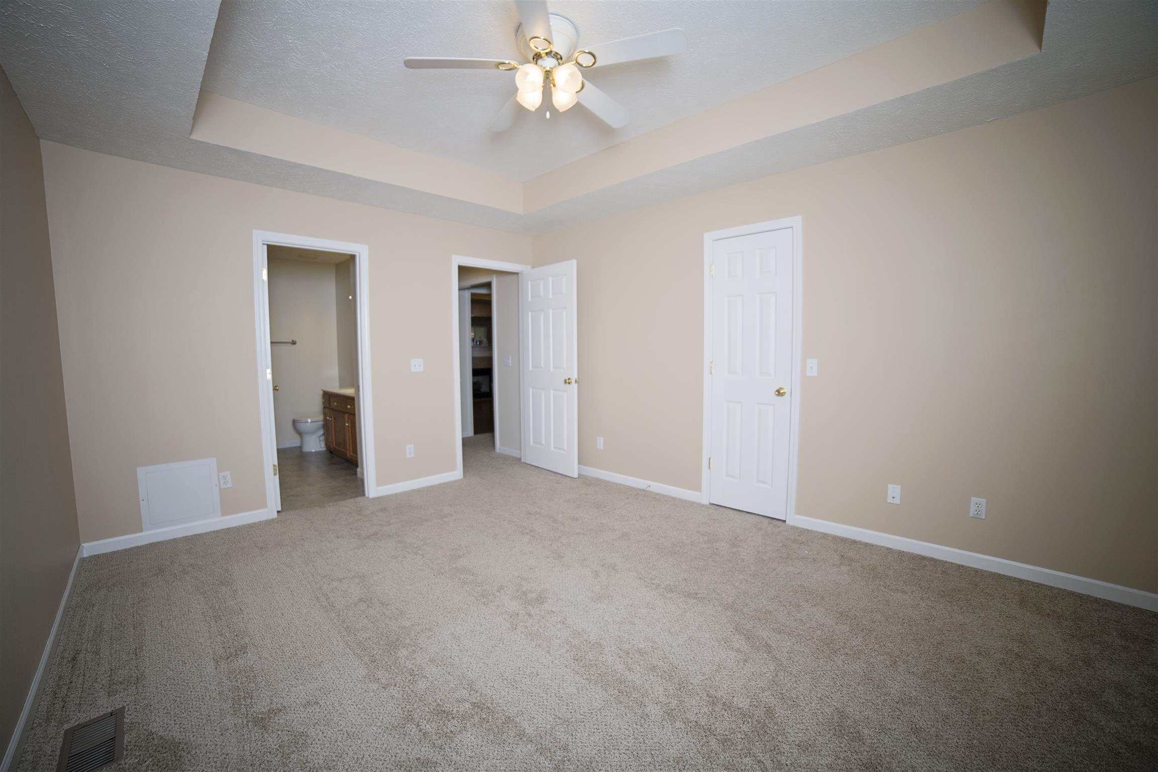 134 Hunt Creek Road Manchester, TN 37355 - Photo 7 of 14 The trey ceilings and natural light make it feel even larger.