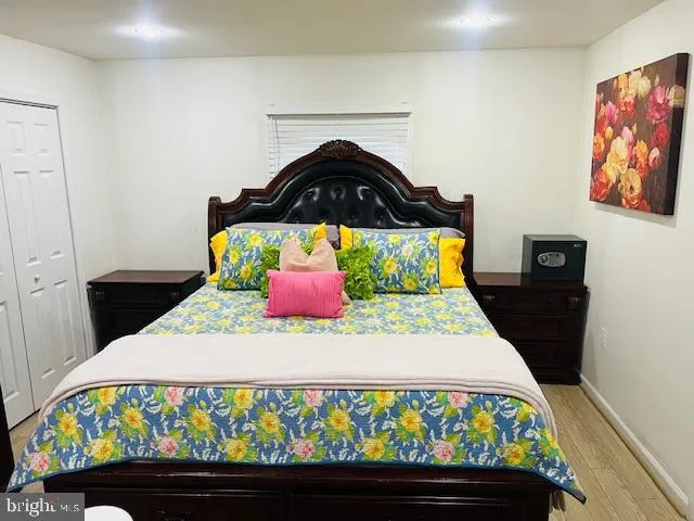 a bedroom with a bed and dresser