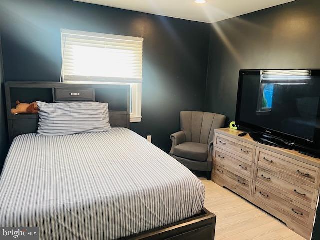 304 East Gordon Street Sterling, VA 20164 - Photo 8 of 17 a bedroom with a bed and a flat screen tv