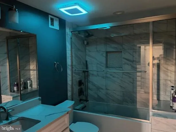 a bathroom with a shower and a sink