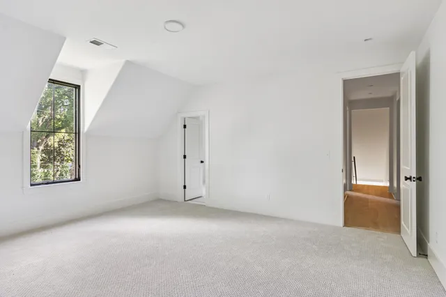 a bathroom with a granite countertop sink mirror and vanity