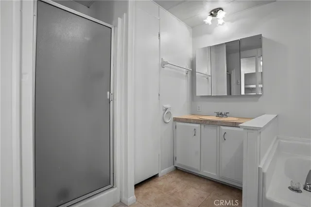a bathroom with a sink and mirror