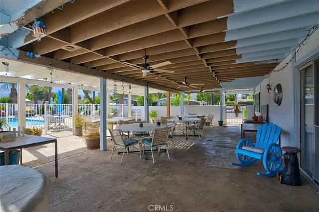 a view of a tables and chairs in patio