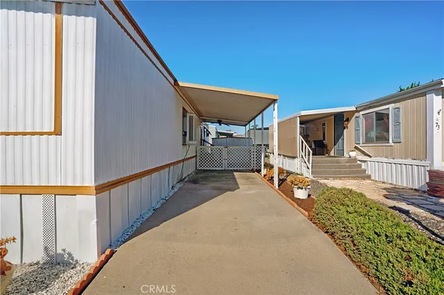 a view of a house with wooden floor and chair