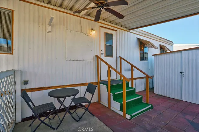 a house that has sitting area in front of it