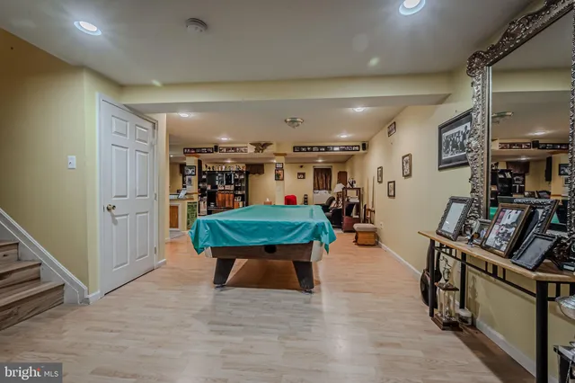 a kitchen with stainless steel appliances kitchen island granite countertop a table and chairs in it