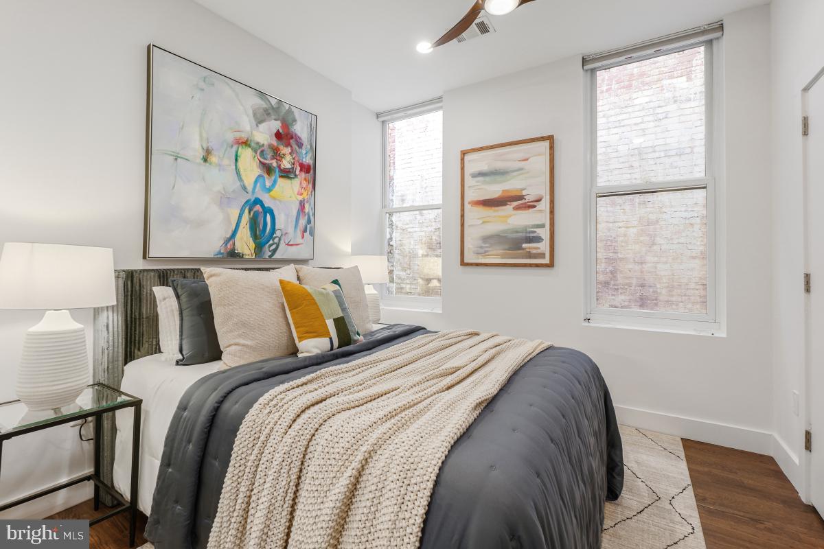 2107 S Street Northwest, Unit M Washington, DC 20008 - Photo 12 of 30 a bed that has couches and painting on the wall