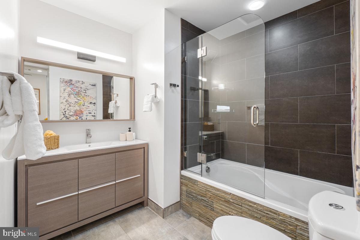 2107 S Street Northwest, Unit M Washington, DC 20008 - Photo 14 of 30 a bathroom with a sink toilet and bathtub