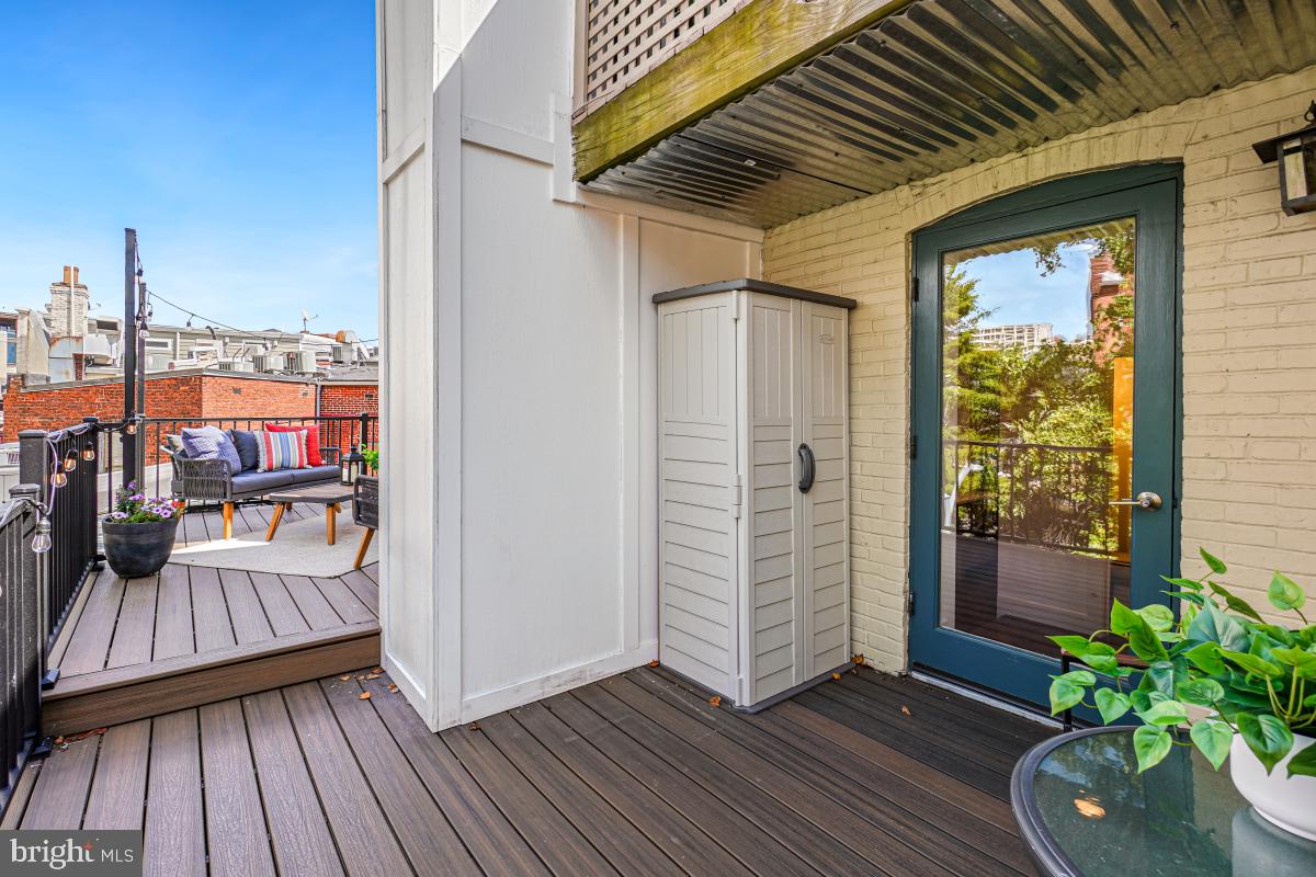 2107 S Street Northwest, Unit M Washington, DC 20008 - Photo 21 of 30 a view of a balcony with wooden floor