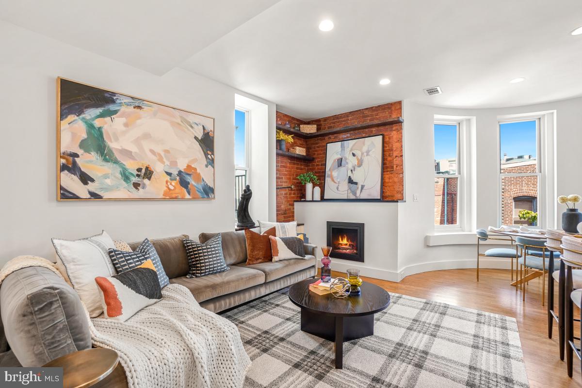 2107 S Street Northwest, Unit M Washington, DC 20008 - Photo 4 of 30 a living room with furniture and a fireplace
