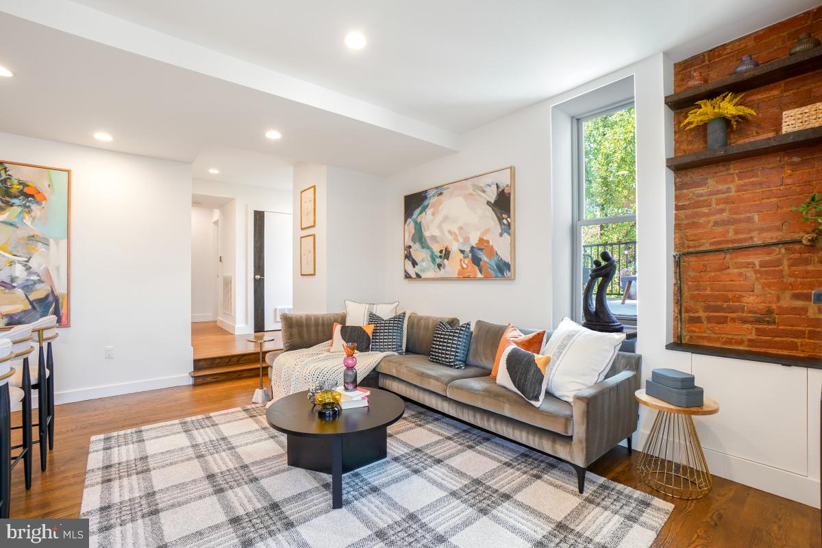 2107 S Street Northwest, Unit M Washington, DC 20008 - Photo 5 of 30 a living room with furniture and a large window