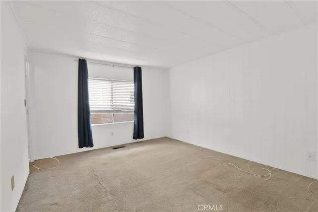 a view of an empty room and window