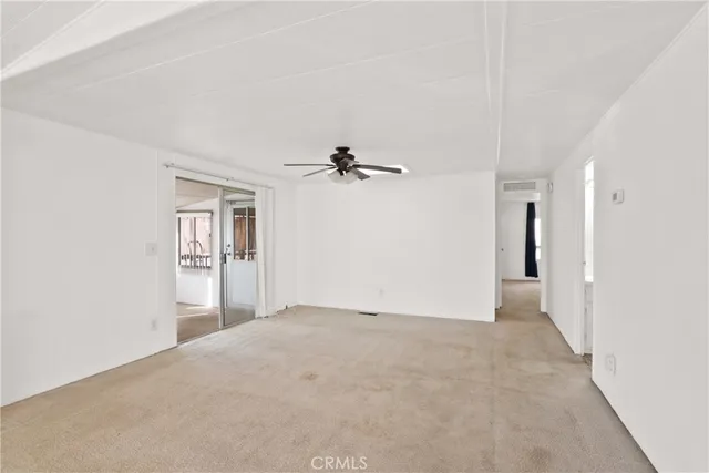 an empty room with a empty space and windows