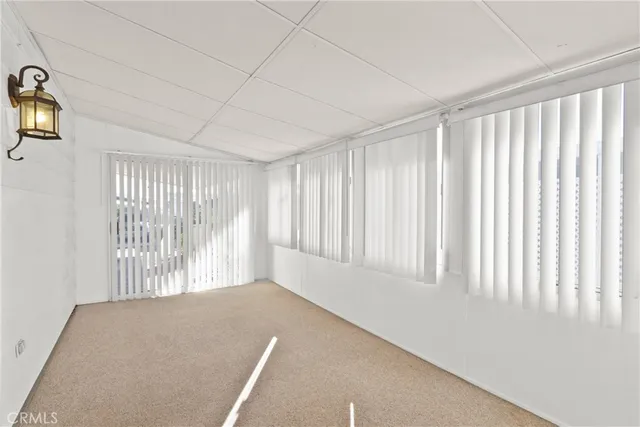 a view of empty room with windows