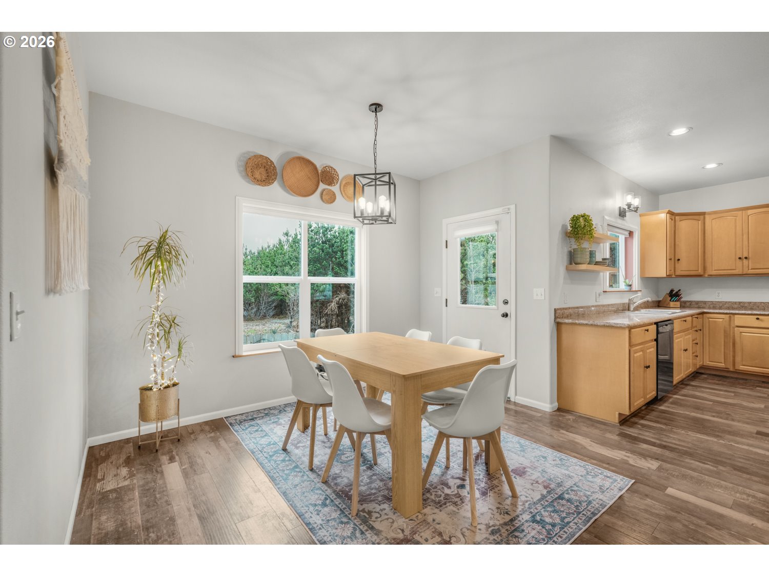 2927 Ruby Court Bandon, OR 97411 - Photo 13 of 38 a view of a dining room with furniture window and wooden floor