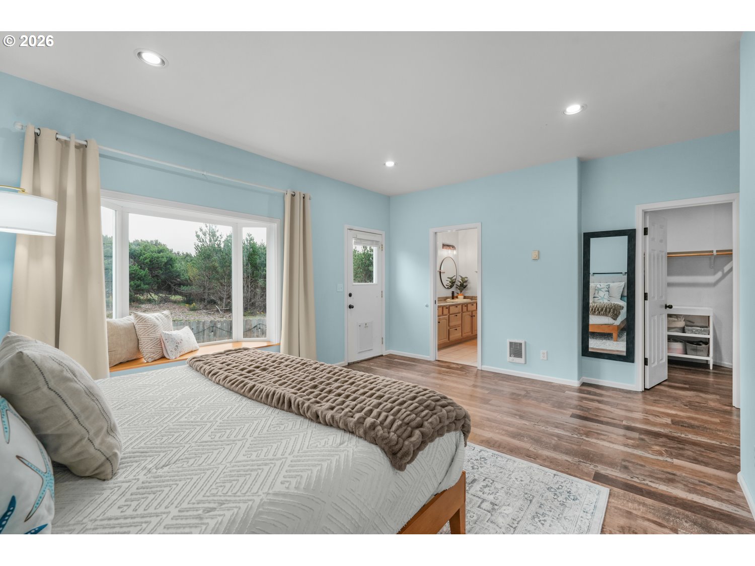 2927 Ruby Court Bandon, OR 97411 - Photo 15 of 38 a bedroom with a bed and large window
