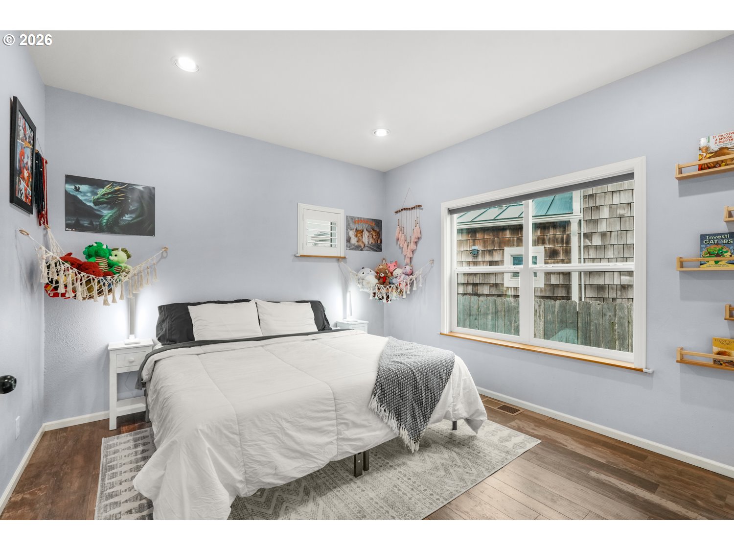 2927 Ruby Court Bandon, OR 97411 - Photo 18 of 38 a bedroom with a large bed and a large window