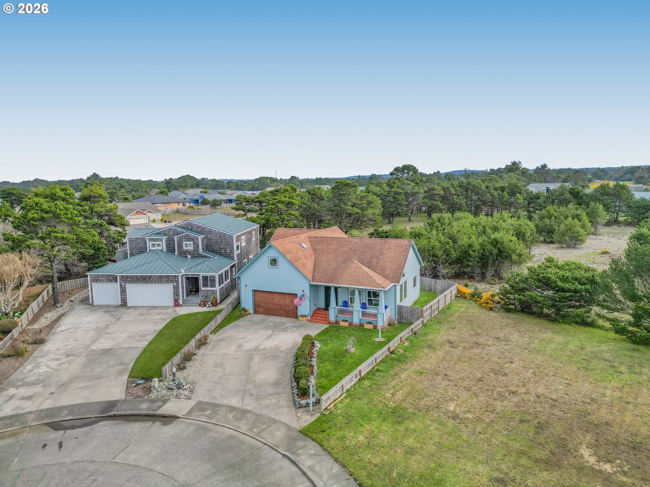 2927 Ruby Court Bandon, OR 97411 - Photo 2 of 38 an aerial view of a house with a garden
