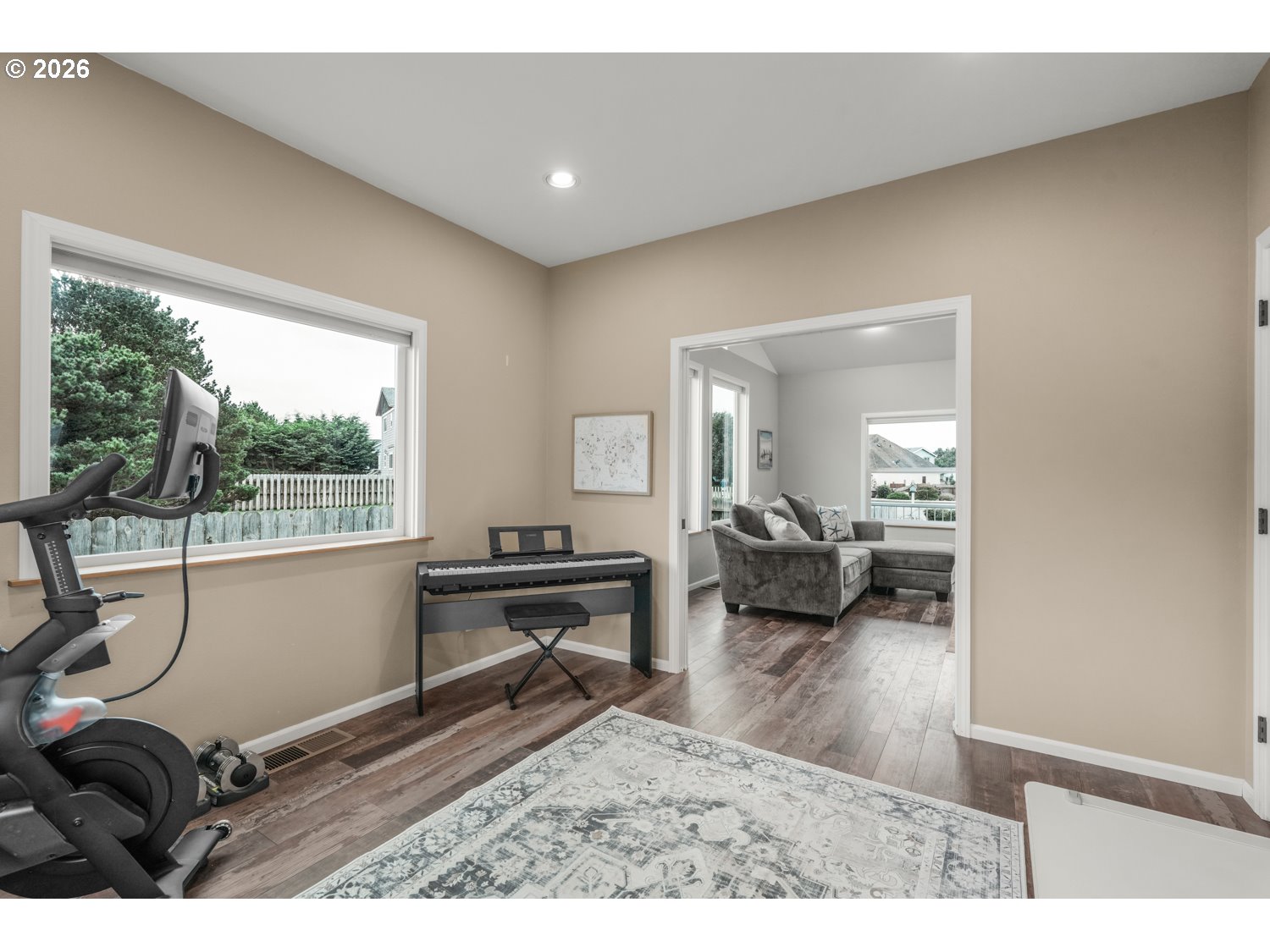 2927 Ruby Court Bandon, OR 97411 - Photo 21 of 38 a living room with furniture a window and a wooden floor