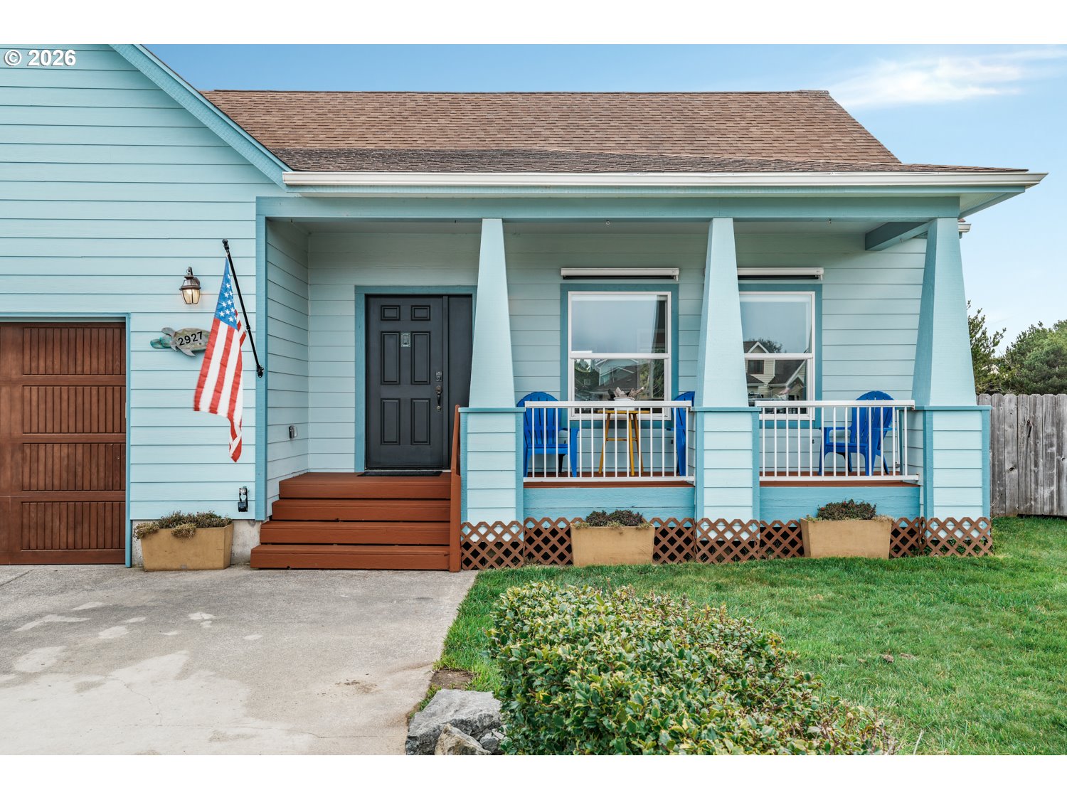 2927 Ruby Court Bandon, OR 97411 - Photo 31 of 38 a front view of a house with a yard