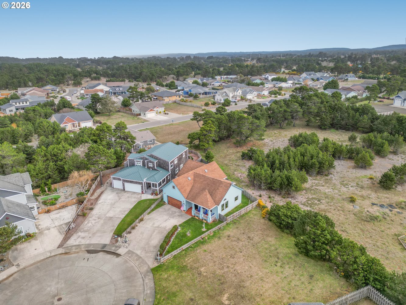 2927 Ruby Court Bandon, OR 97411 - Photo 36 of 38 an aerial view of a house with a garden