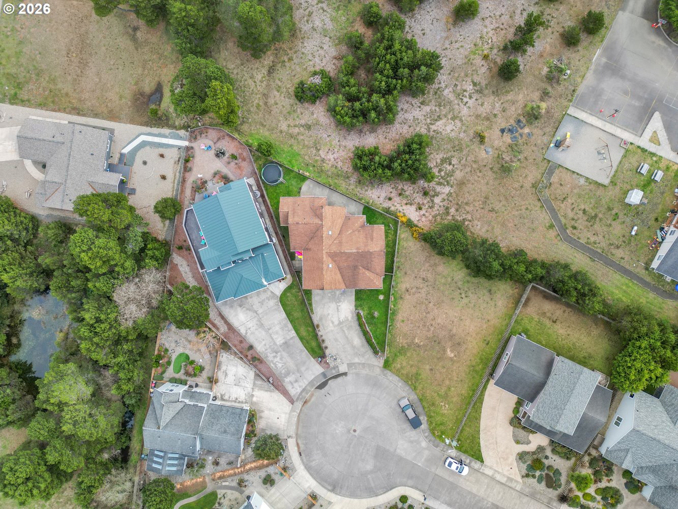 2927 Ruby Court Bandon, OR 97411 - Photo 38 of 38 an aerial view of a house with outdoor space and seating area