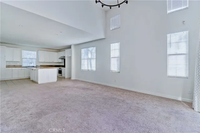 a view of a kitchen with a sink cabinets and a window