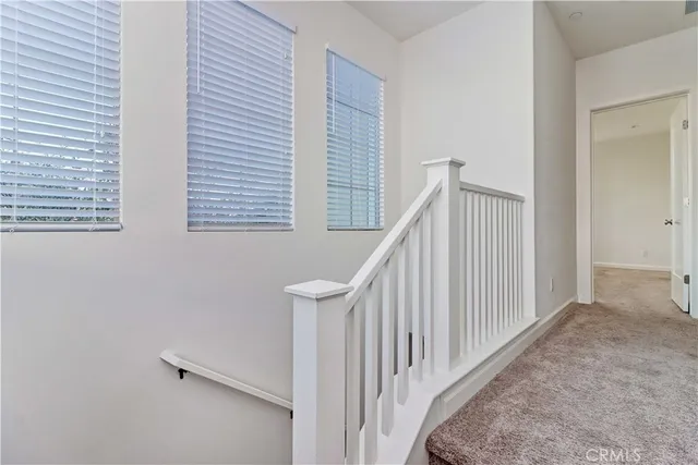 a view of a hallway with staircase