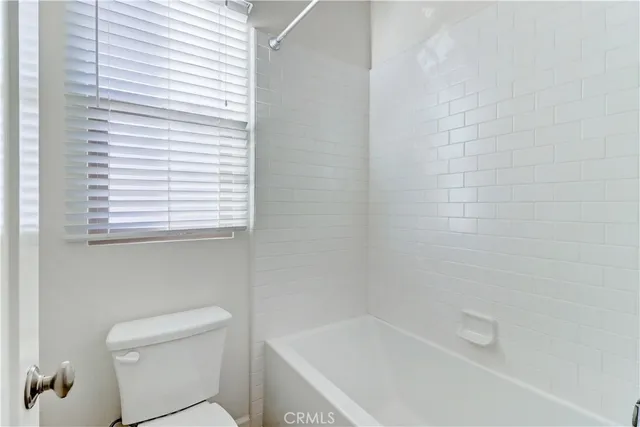 a bathroom with double sink and a mirror