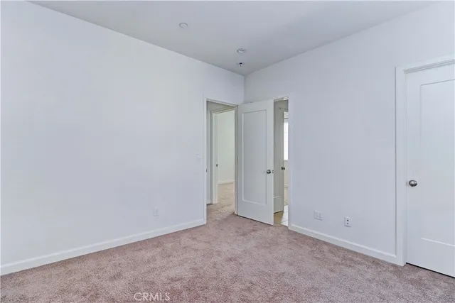 a table with white wooden cabinets
