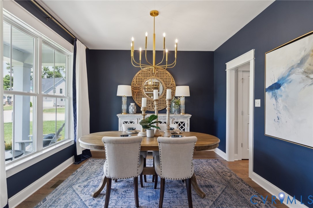 Lot 15 Robins Ridge Drive Moseley, VA 23120 - Photo 6 of 18 a view of a dining room with furniture a chandelier and wooden floor
