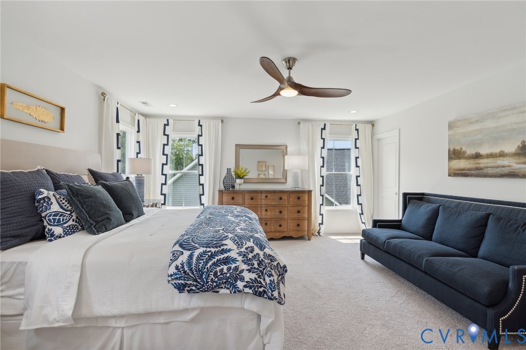 Lot 15 Robins Ridge Drive Moseley, VA 23120 - Photo 10 of 18 a spacious bedroom with a bed a couch and a chandelier