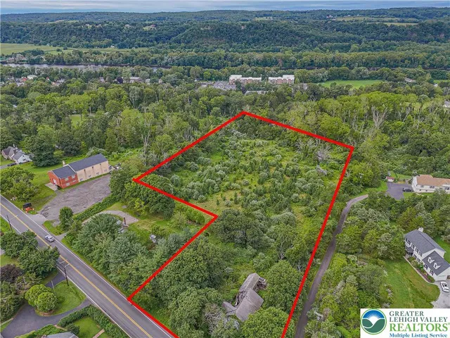 an aerial view of lake and residential houses