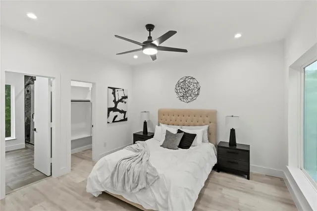 a bedroom with a bed and a table