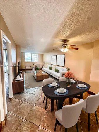 a kitchen with granite countertop a stove cabinets and stainless steel appliances