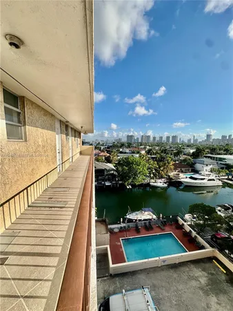 a kitchen with a sink a stove and cabinets