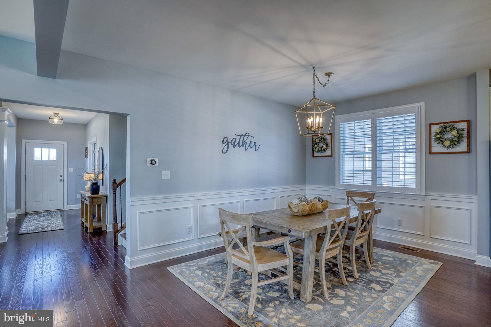 513 Spring Hollow Drive Middletown, DE 19709 - Photo 21 of 83 a view of a dining room with furniture window and wooden floor