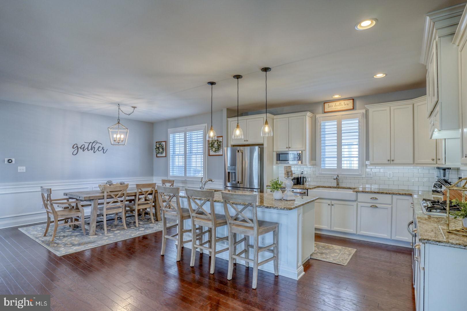 513 Spring Hollow Drive Middletown, DE 19709 - Photo 23 of 83 a large kitchen with lots of counter space and dining table