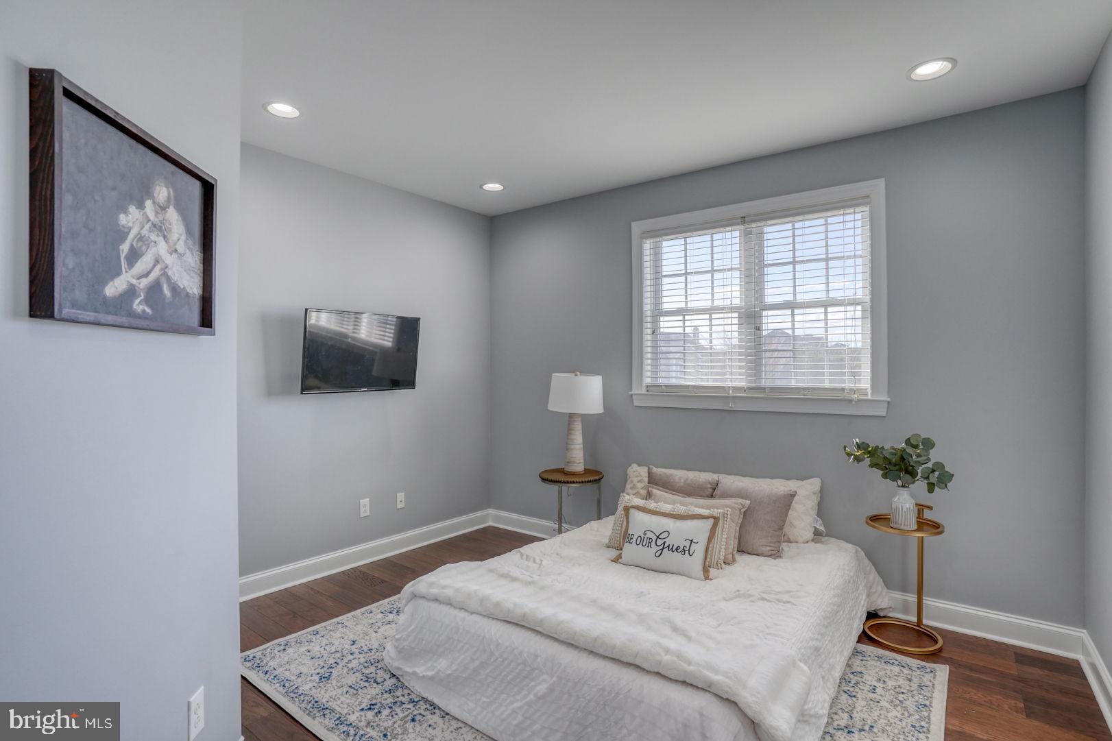513 Spring Hollow Drive Middletown, DE 19709 - Photo 24 of 83 a bedroom with a bed and a painting on the wall