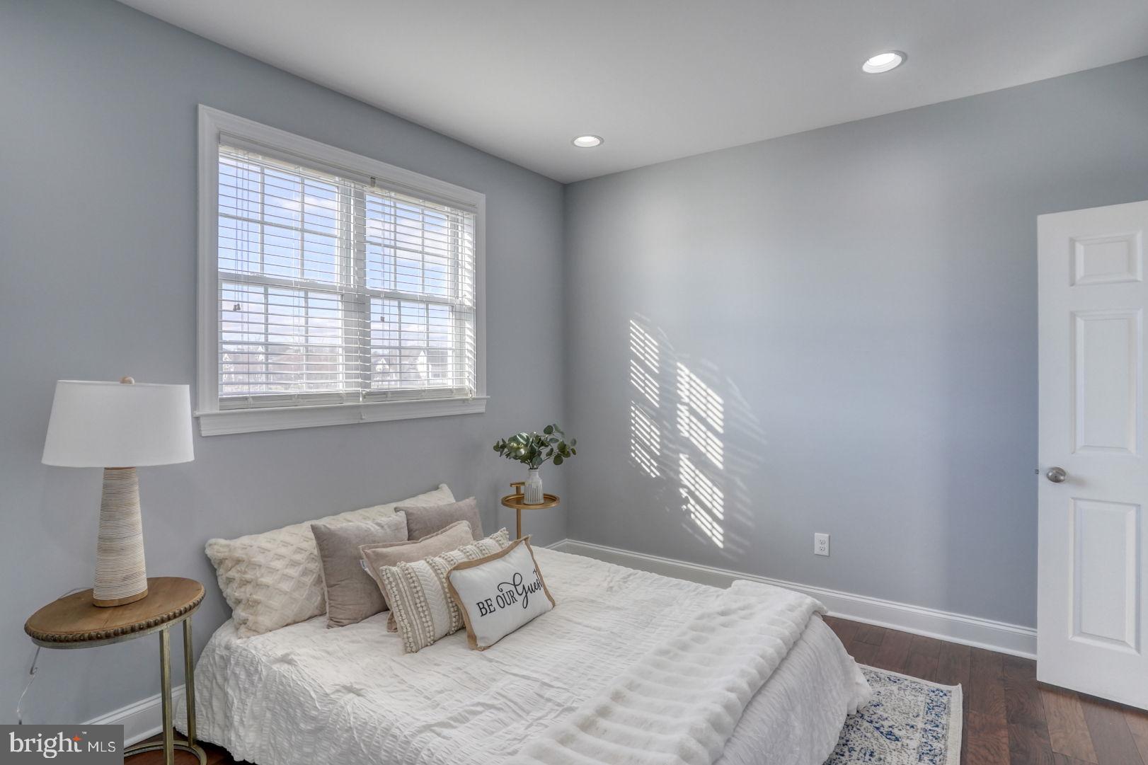 513 Spring Hollow Drive Middletown, DE 19709 - Photo 25 of 83 a bedroom with a bed and a lamp