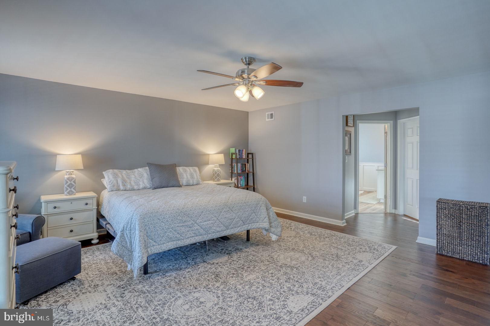 513 Spring Hollow Drive Middletown, DE 19709 - Photo 30 of 83 a bedroom with a bed and a chandelier
