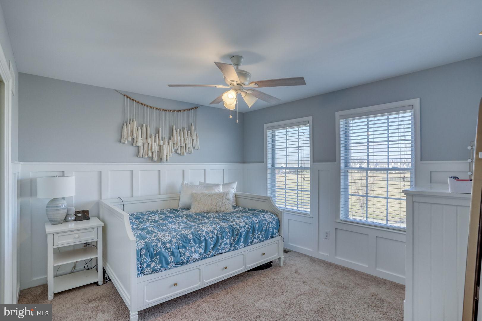 513 Spring Hollow Drive Middletown, DE 19709 - Photo 37 of 83 a bedroom with a large bed chandelier and a window