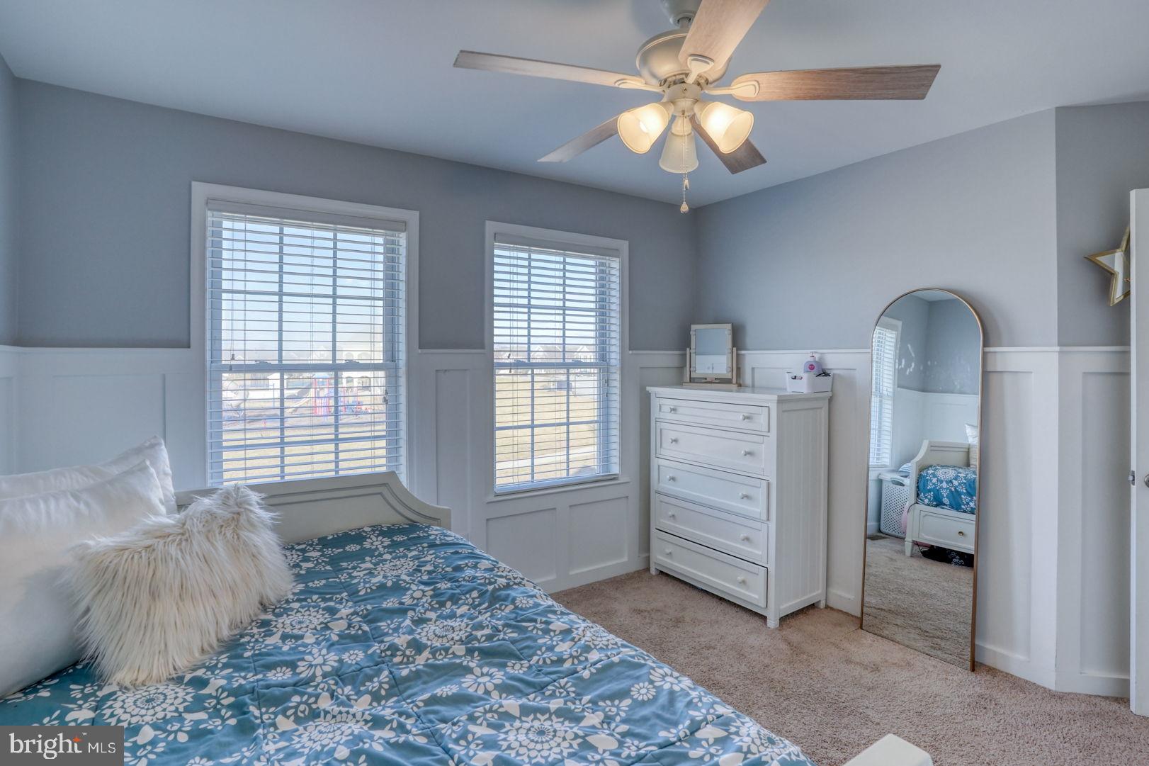 513 Spring Hollow Drive Middletown, DE 19709 - Photo 38 of 83 a bedroom with a bed and a chandelier