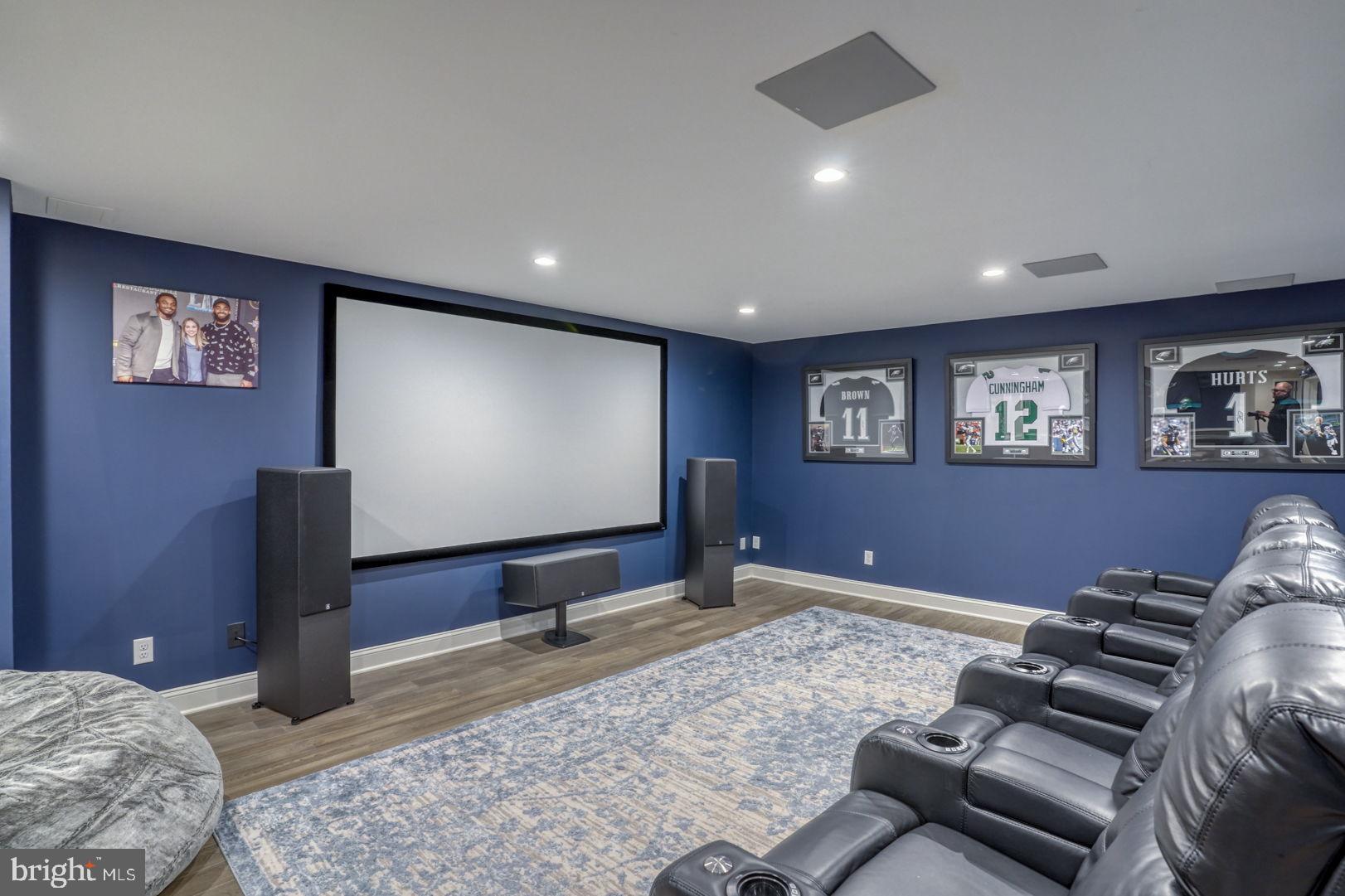 513 Spring Hollow Drive Middletown, DE 19709 - Photo 43 of 83 a projector room with a couch and a flat screen tv